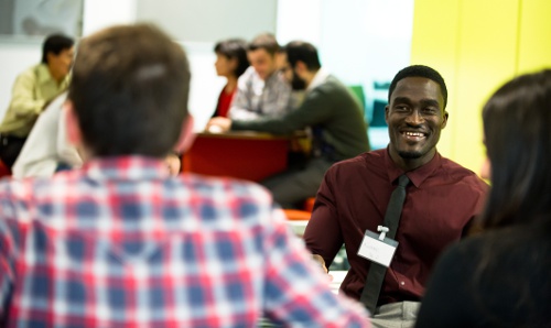 researchers smiling in discussion